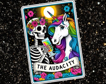 May include: A tarot card with a colorful illustration of a skeleton and a unicorn raising a glass of liquid. The card is titled "The Audacity".
