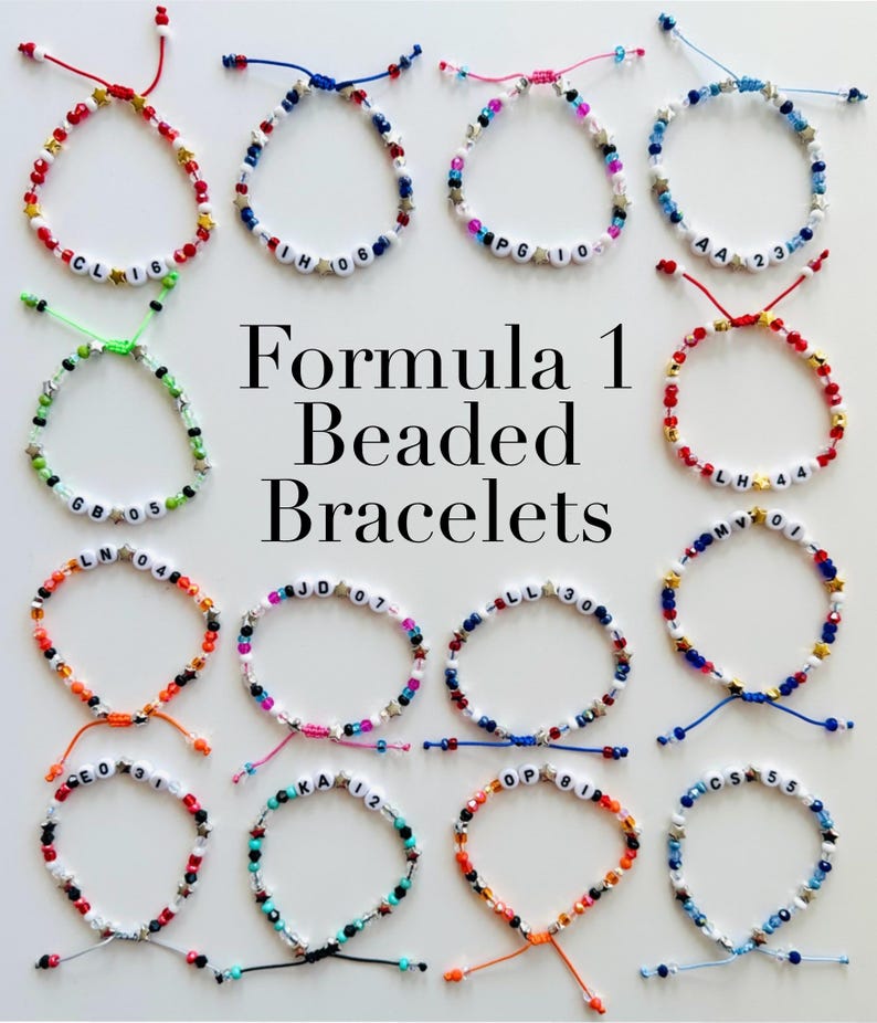 May include: A collection of sixteen adjustable beaded bracelets featuring colourful beads, small gold-tone star spacers, and white letter beads displaying various initials and numbers. The text Formula 1 Beaded Bracelets is centred.