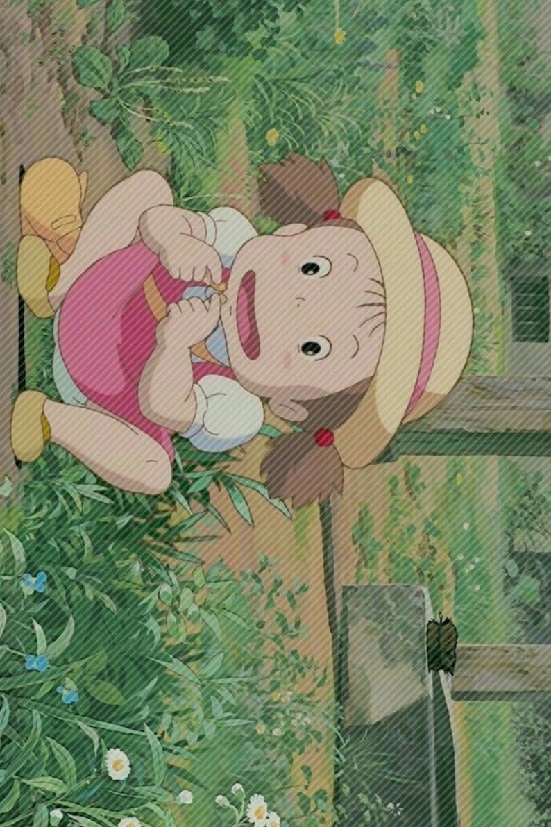 May include: A young girl with brown hair and a pink and white dress sits on a wooden surface. She is wearing a straw hat with a pink ribbon. The girl is looking to the side with a surprised expression. The background is a green garden with plants and flowers.