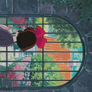 May include: A young girl with brown hair and a red bow looks out a window with a barred, oval frame. The window shows a view of a brick building with green foliage and flowers.