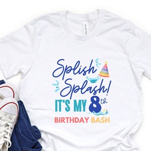 May include: White t-shirt with blue text that says "Splish Splash! It's My 8th Birthday Bash". The text is decorated with a rainbow party hat, a blue wave, and a blue and white beach ball.