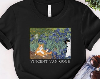 May include: Black t-shirt with a print of a painting by Vincent van Gogh featuring two cats in a field of purple irises.