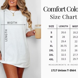 May include: A white t-shirt with a size chart, labeled "Comfort Colors." The chart lists measurements in inches for sizes S through 4XL. The shirt is labeled "1717 Unisex T-Shirt."