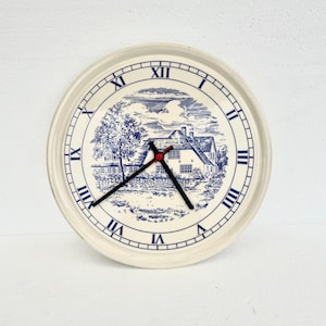 Vintage Ceramic Wall Clock with Blue and White Country Scene – Roman Numerals – Rustic Farmhouse Decor
