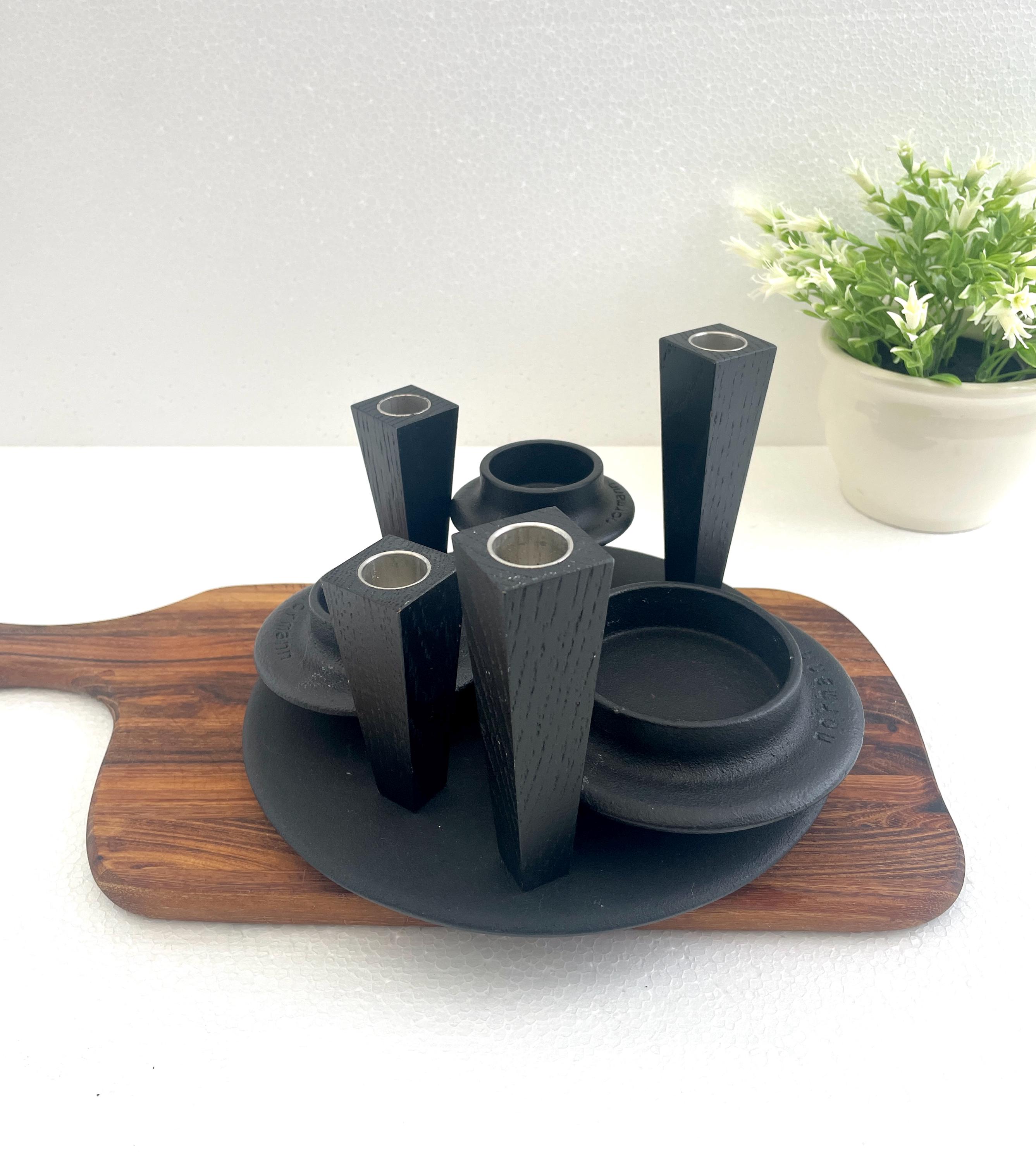 Set -Normann Copenhagen Candle Holders, Cast iron with base plate and 4 magnetic wooden black oak candlesticks by LindDNaA