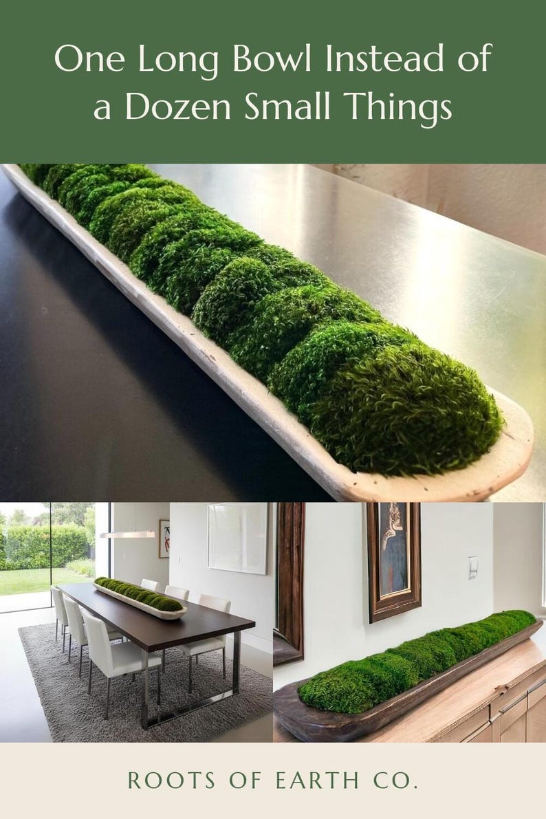 May include: A long, narrow, light-colored wooden dough bowl filled with vibrant green preserved moss. The text "One Long Bowl Instead of a Dozen Small Things" appears at the top, and "ROOTS OF EARTH CO." is printed at the bottom of the image.