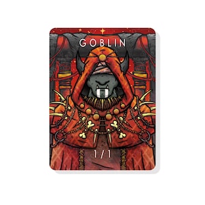 May include: A fantasy card illustration of a goblin wearing a red robe with a bone and chain necklace. The card has the word "GOBLIN" at the top and "1/1" at the bottom.