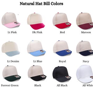May include: A grid of twelve baseball caps with natural-colored crowns and various colored bills, including light pink, dark pink, red, maroon, light denim, light blue, royal blue, navy, forest green, black, all-black, and all-white options.