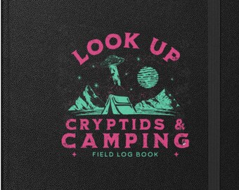 May include: Black notebook with a pink and teal graphic design that says "Look Up Cryptids & Camping Field Log Book".
