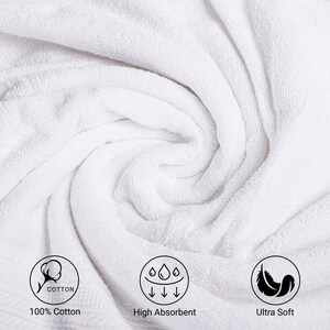 May include: Close-up of a white, fluffy towel with a cotton icon, text that says "100% Cotton", a water drop icon, text that says "High Absorbent", and a feather icon with text that says "Ultra Soft".