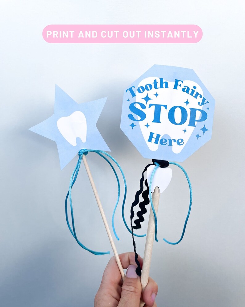 May include: Two tooth fairy wands, one shaped like a star and the other a stop sign. Both are blue with white tooth outlines and the stop sign says "Tooth Fairy Stop Here".
