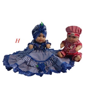 2 Ibeyis Jimaguas Twin Dolls dressed in blue and red gingham