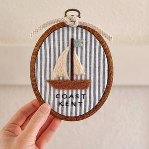 May include: A weathered wooden sign, inscribed with 'Welcome to our home' in white. The sign has a distressed appearance, suggesting a vintage aesthetic, and is suitable for a porch or hallway.