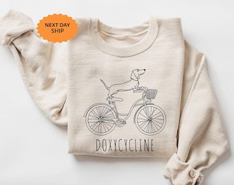 Doxycycline Pharmacy Pun Sweatshirt, Dachshund Bicycle Pharmacist Gift