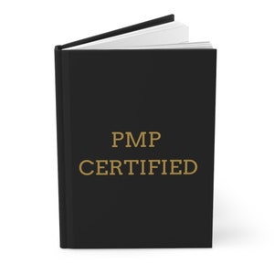 May include: A black book with the text "PMP CERTIFIED" in gold lettering.