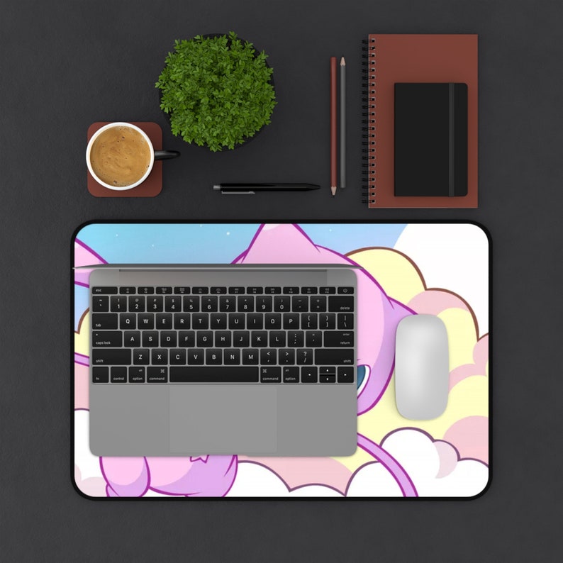 May include: A pink and purple cartoon character with a long tail and a cloud background. The character is on a mouse pad with a laptop and a mouse on top of it.