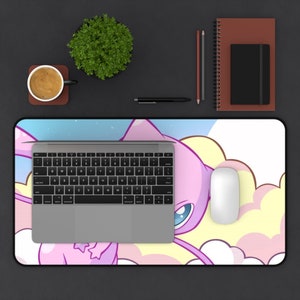 May include: A pink and yellow cartoon character with large blue eyes on a white and blue background. The character is flying in the clouds. The mousepad is designed for a computer mouse.