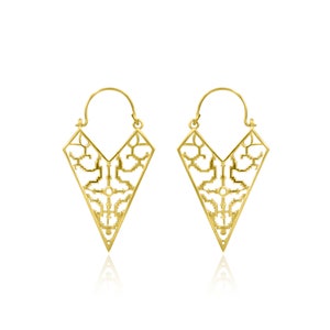 May include: A pair of gold-colored, geometric earrings. Each earring features a triangular shape with an open, intricate filigree design. The earrings have a hook closure and are displayed against a white background.
