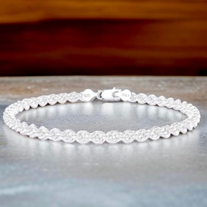 May include: A silver rope chain bracelet with a 925 Italy stamp.