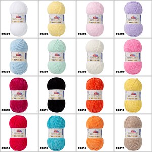 May include: Assortment of 18 balls of Himalaya Dolphin Baby yarn in various colours, including white, yellow, pink, lavender, light blue, mint green, red, black, orange, and beige. Each ball has a label with the brand name "Himalaya" and the yarn name "Dolphin Baby".