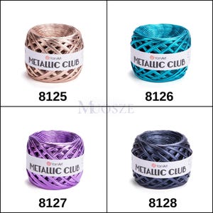 May include: Four spools of metallic yarn in different colors: gold, teal, purple, and gray. Each spool has a label that reads "YarnArt Metallic Club".