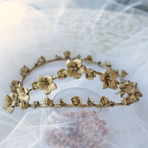 This is a detail photograph of the beautiful and delicate handmade gold porcelain flower tiara.