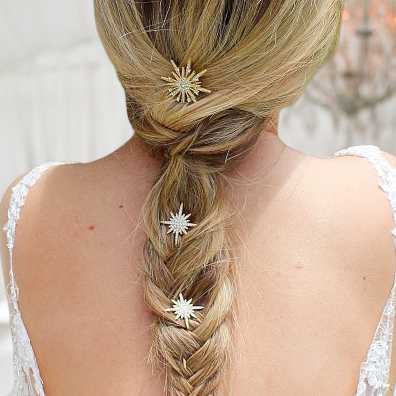 This image shows the bride with her blonde hair up and bridal bobby pins scattered throughout her hair.