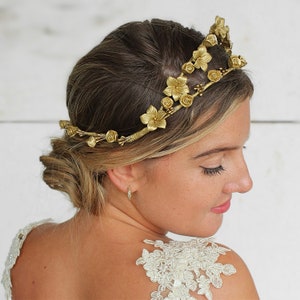 In this image we can see the bride with her porcelain sparkle gold flower crown