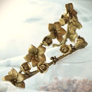 This is a detail photograph of the beautiful and delicate handmade gold porcelain flower tiara.