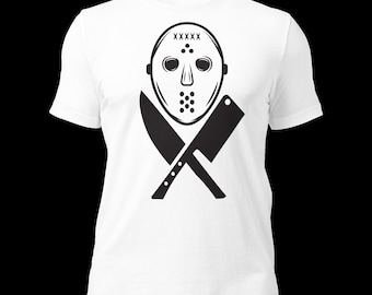 May include: White t-shirt with a black and white graphic of a hockey mask with crossed knives. The mask has the text "XXXXX" on the top.