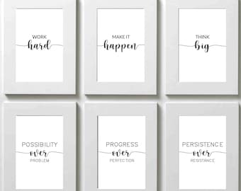 May include: Nine framed prints with motivational quotes in black text on a white background. The quotes are: "strength", "courage", "resilience", "work hard", "make it happen", "think big", "possibility over problem", "progress over perfection", and "persistence over resistance".