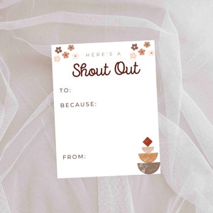May include: A white card with brown text that says "Here's a Shout Out". The card has a space to write "To:", "Because:", and "From:". The card is decorated with small brown and pink flowers and a brown, orange, and red geometric design.