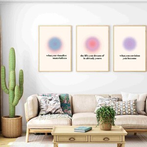 May include: Three framed prints with motivational quotes and abstract colourful circles. The quotes are "what you visualise materialises", "the life you dream of is already yours", and "what you envision you become".