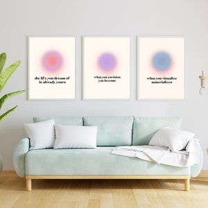 May include: Three framed prints with pastel coloured circles and inspirational quotes. The quotes are "the life you dream of is already yours", "what you envision you become", and "what you visualize materializes".