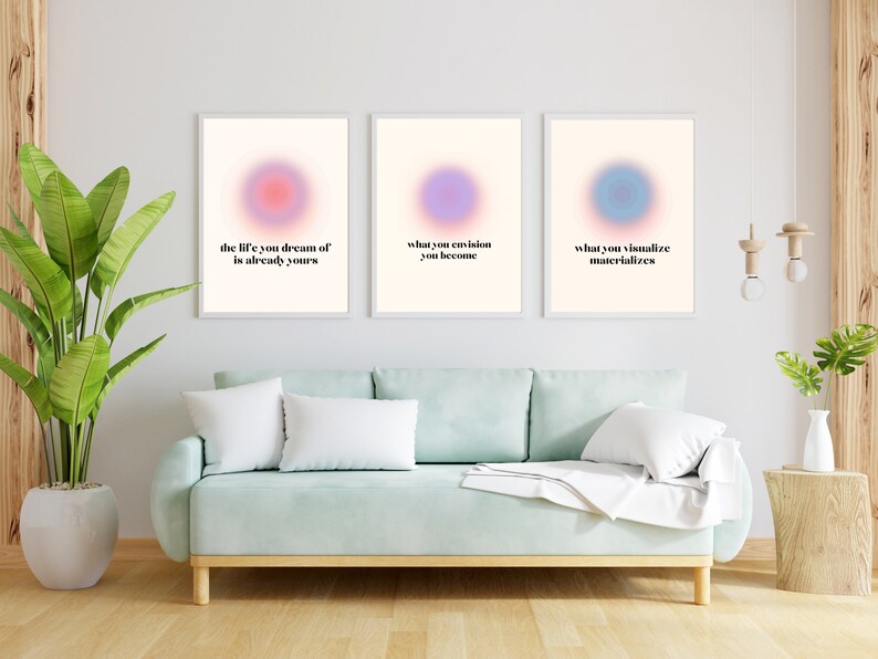 May include: Three framed prints with pastel coloured circles and inspirational quotes. The quotes are "the life you dream of is already yours", "what you envision you become", and "what you visualize materializes".