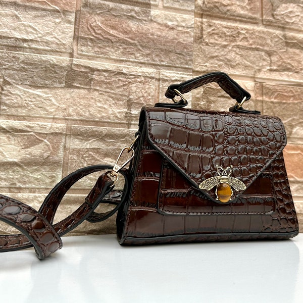 Brown clutch bag. Dark brown handbag