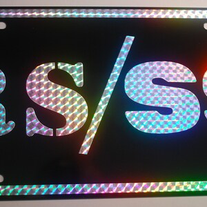 Targa RS/SS METAL 12 x 6 nera con scritta Prism retrò