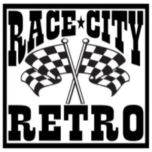 May include: Black and white graphic with the words "RACE CITY RETRO" in bold font. Two crossed checkered flags are in the center. The design is enclosed in a black rectangular border.