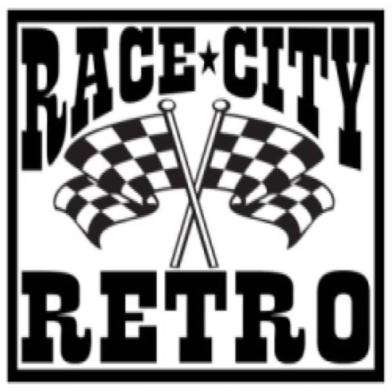May include: Black and white graphic with the words "RACE CITY RETRO" in bold font. Two crossed checkered flags are in the center. The design is enclosed in a black rectangular border.