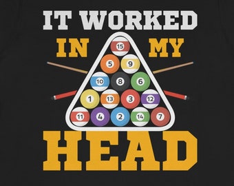 May include: Black t-shirt with a white graphic of a pool ball rack with the text "IT WORKED IN MY HEAD" in yellow.