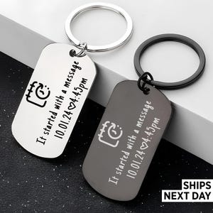 May include: Two rectangular metal keychains, one silver and one black, each featuring a split ring. Both are engraved with a calendar icon, the text "It started with a message", and the date "10.01.24" followed by a heart and "4:45pm".