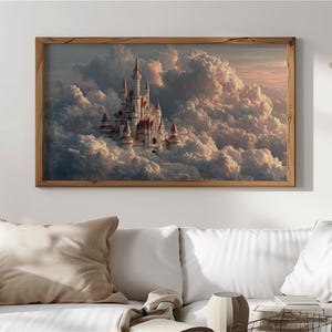 May include: A framed print depicts a white castle with red-topped turrets floating among fluffy clouds. The artwork is set against a soft, pastel sky, and framed in a natural wood. The overall theme is fantasy and fairytale.