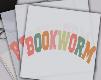 May include: A stack of clear sheets with a colorful "BOOKWORM" design printed on the top sheet. The sheets are ready to press using a heat press machine.