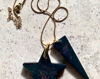 Double Shape Resin Pendant Necklace. Black and Glitter Star and Triangle Drops. Stainless Steel Gold Chain. Modern Alternative Jewellerry.
