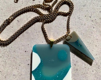 Double Shape Resin Pendant Necklace. Coastal Deep Sea Slab and triangle Pendants. Stainless Steel Gold Chain. Modern Alternative Jewellery.