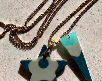 Double Shape Resin Pendant Necklace. Coastal Deep Sea Star and Bar Pendant Drops. Stainless Steel Gold Chain. Modern Alternative Jewellery.