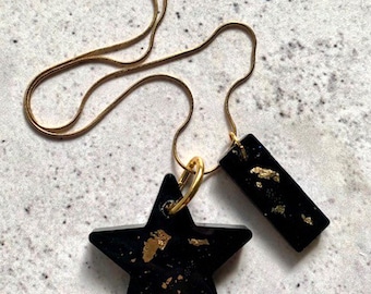 Double Shape Resin Pendant Necklace. Black and Gold Star and Bar Drops. Stainless Steel Gold Chain. Modern Alternative Jewellery.