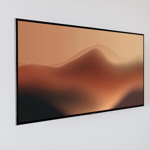 Könnte beinhalten: Ein großer, rechteckiger Flachbildfernseher an einer weißen Wand. Der Bildschirm zeigt ein Gradientenbild von sich wellenden, verschwommenen braunen und beigen Hügeln. Der Fernseher hat einen dünnen, schwarzen Rahmen.