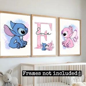May include: Three framed prints featuring a blue Stitch character, a pink Stitch character, and a pink letter E with the name "Evie" on it. The prints have a watercolour background.