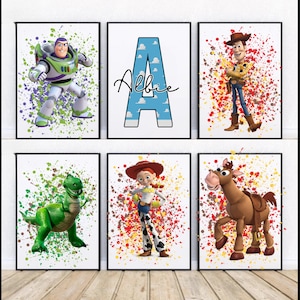 May include: Six framed prints featuring characters from the Toy Story movie franchise. The prints are on a white background with colorful paint splatters. The characters include Woody, Buzz Lightyear, Jessie, Rex, and Bullseye. The sixth print features the letter A with the name Albie written in cursive.